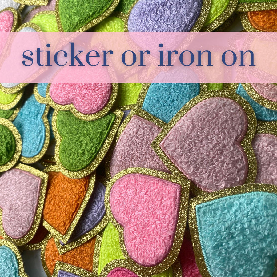 a pile of colorful iron - on patches with the words sticker or iron on